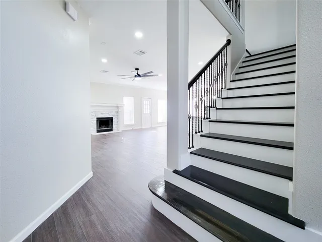 a kitchen with stainless steel appliances a stove a sink and a refrigerator