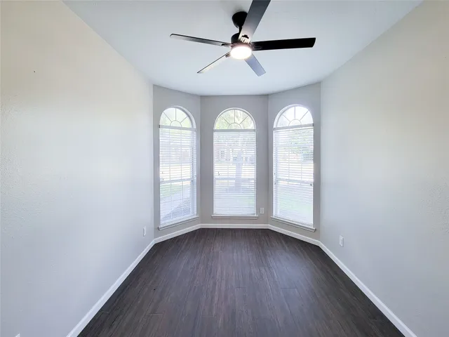 a view of a kitchen with a sink oven cabinets and wooden floor