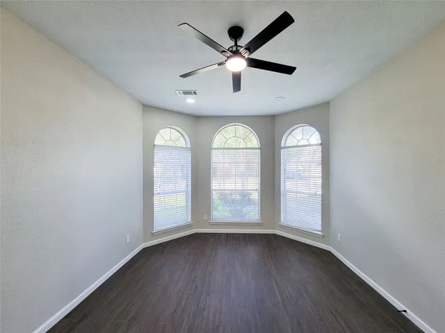 a bathroom with a granite countertop sink a toilet and bathtub