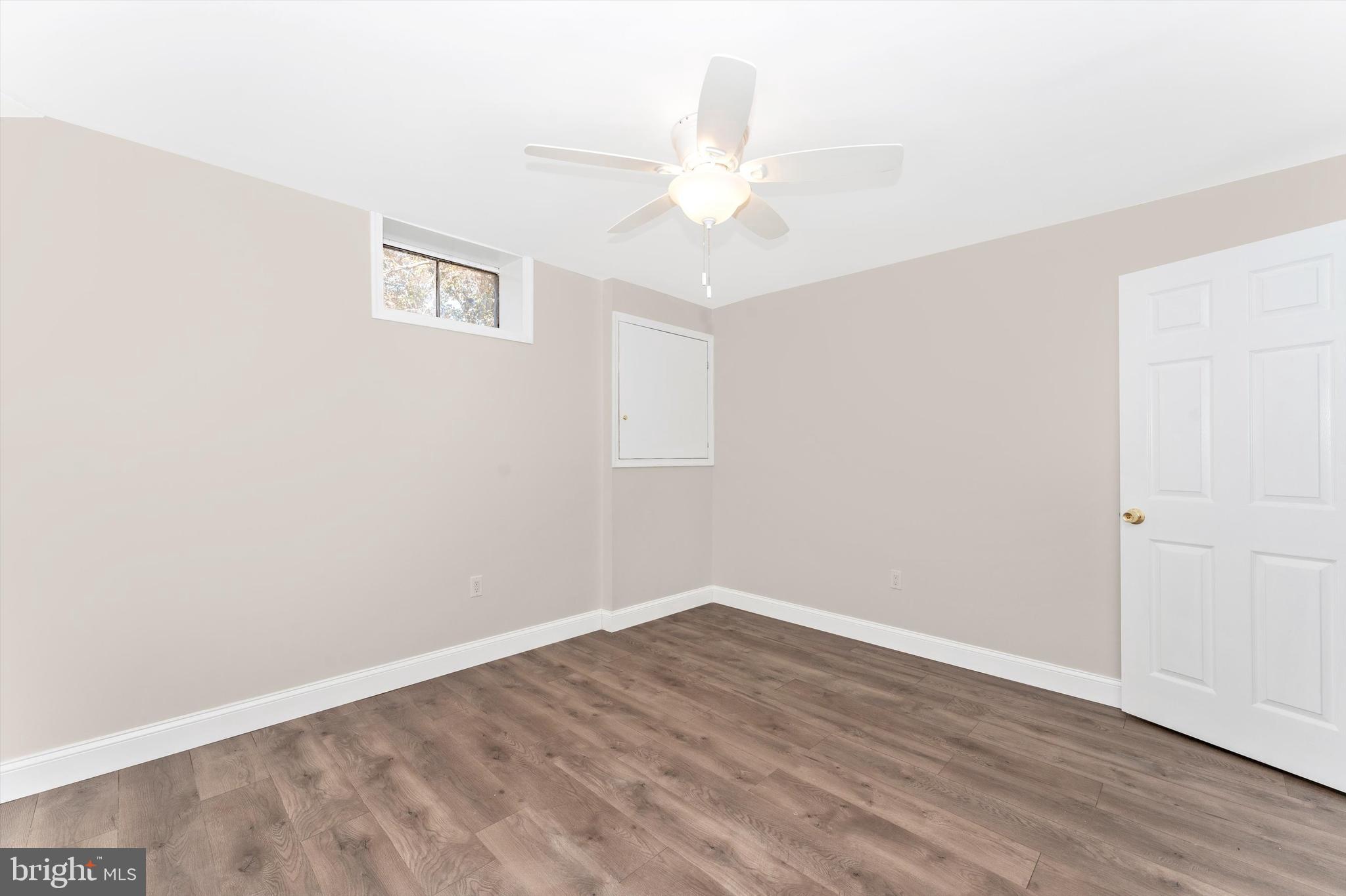4216 Sykesville Road, Unit B Finksburg, MD 21048 - Photo 14 of 27 an empty room with wooden floor and fan