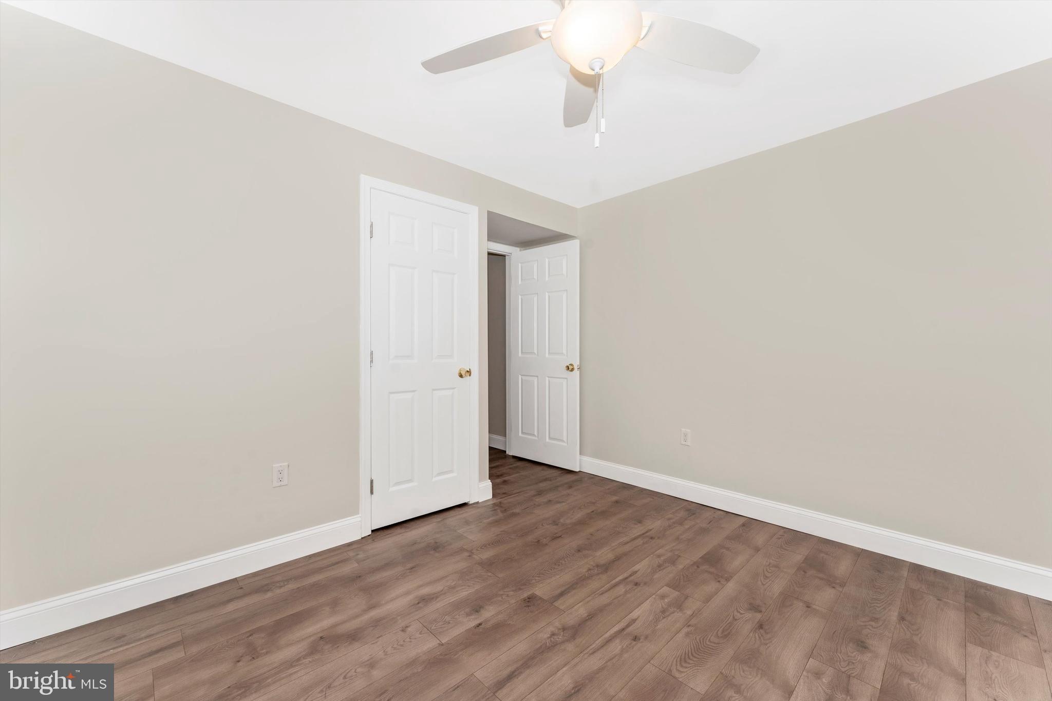 4216 Sykesville Road, Unit B Finksburg, MD 21048 - Photo 18 of 27 an empty room with wooden floor and windows