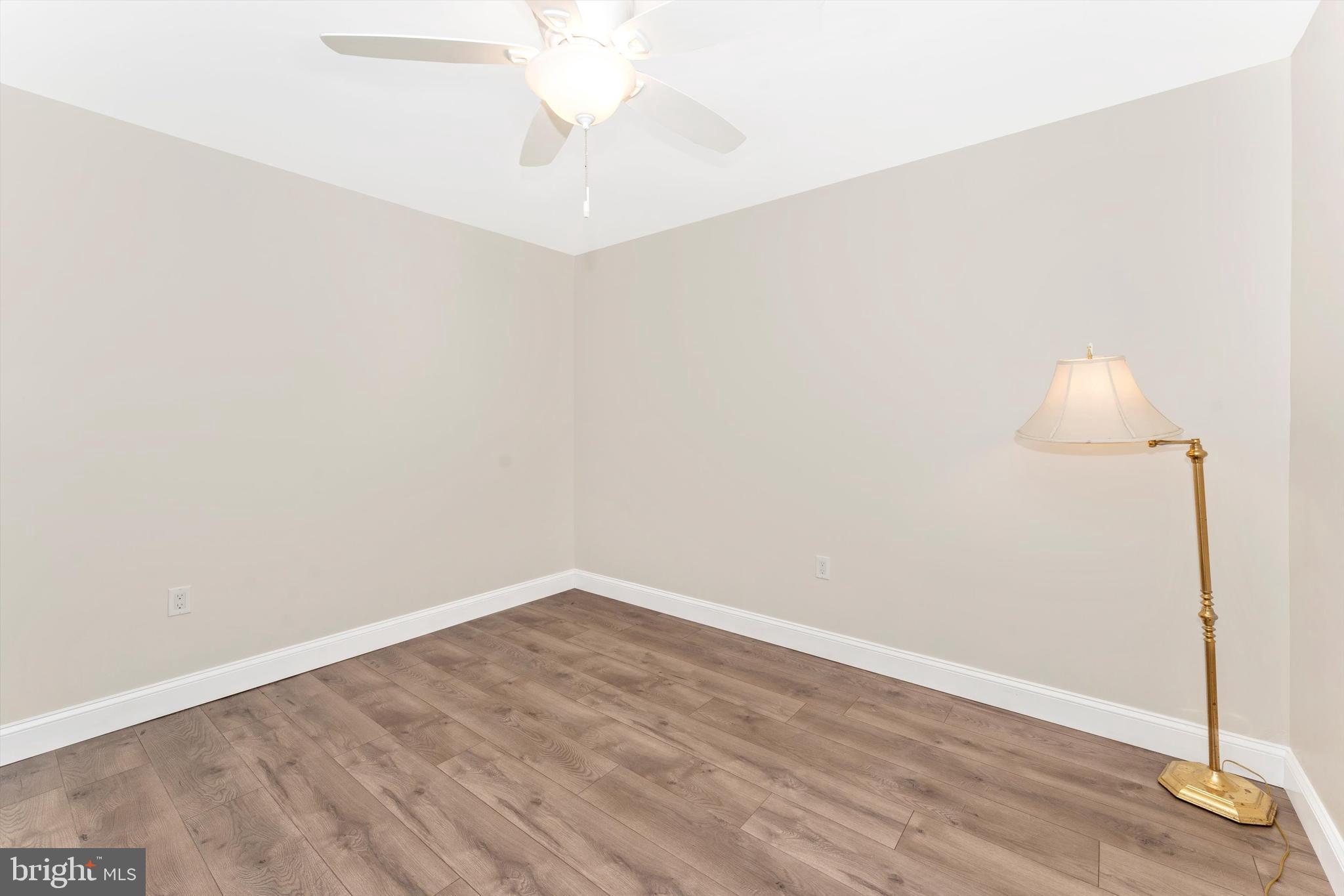 4216 Sykesville Road, Unit B Finksburg, MD 21048 - Photo 20 of 27 an empty room with wooden floor and mirror