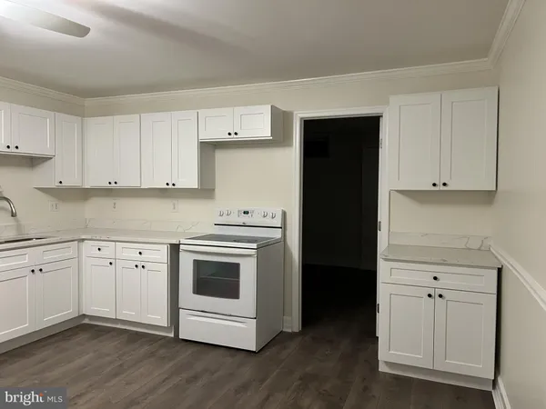 a view of a kitchen with electric appliances