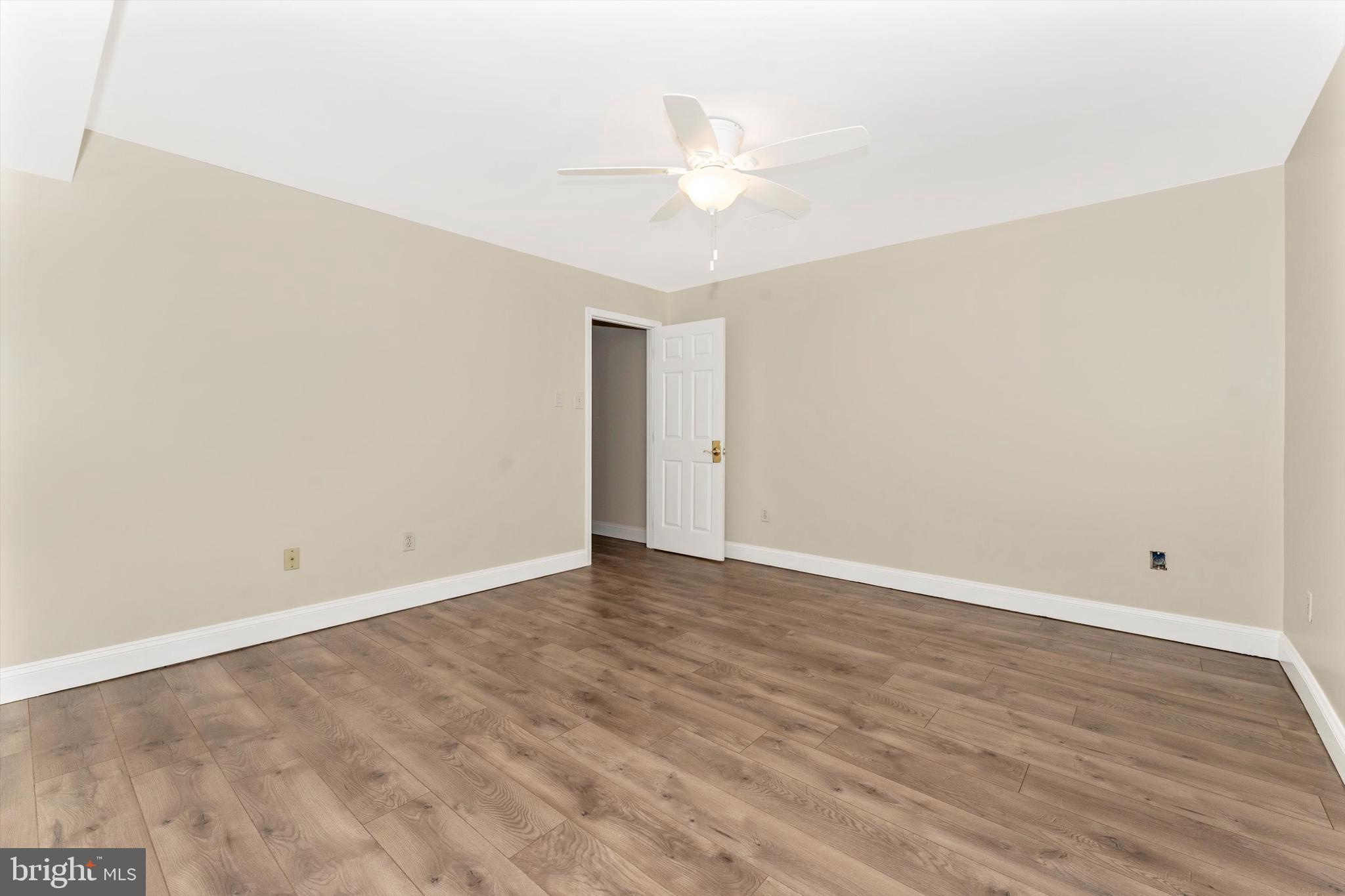 4216 Sykesville Road, Unit B Finksburg, MD 21048 - Photo 9 of 27 a view of an empty room with wooden floor