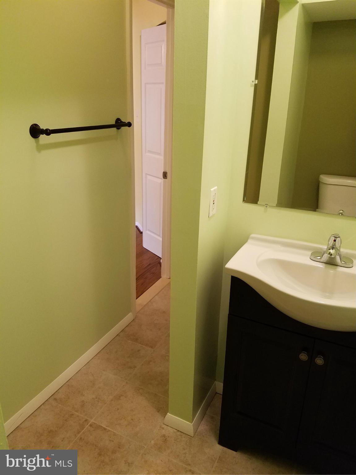 2356 Southgate Square Reston, VA 20191 - Photo 8 of 18 a bathroom with a sink and a mirror