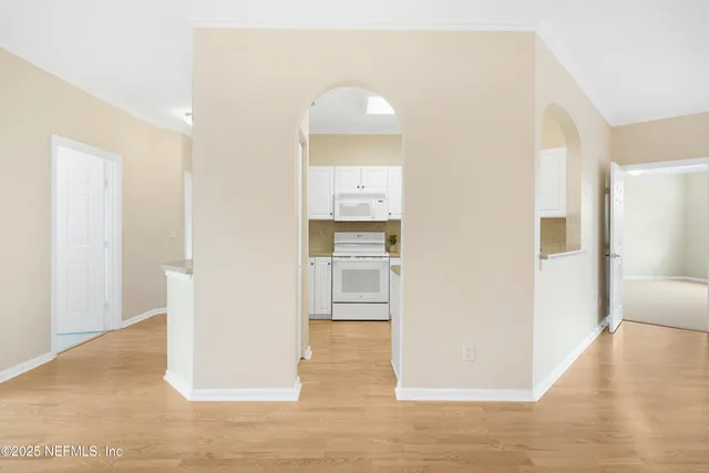 a kitchen with cabinets appliances and a sink