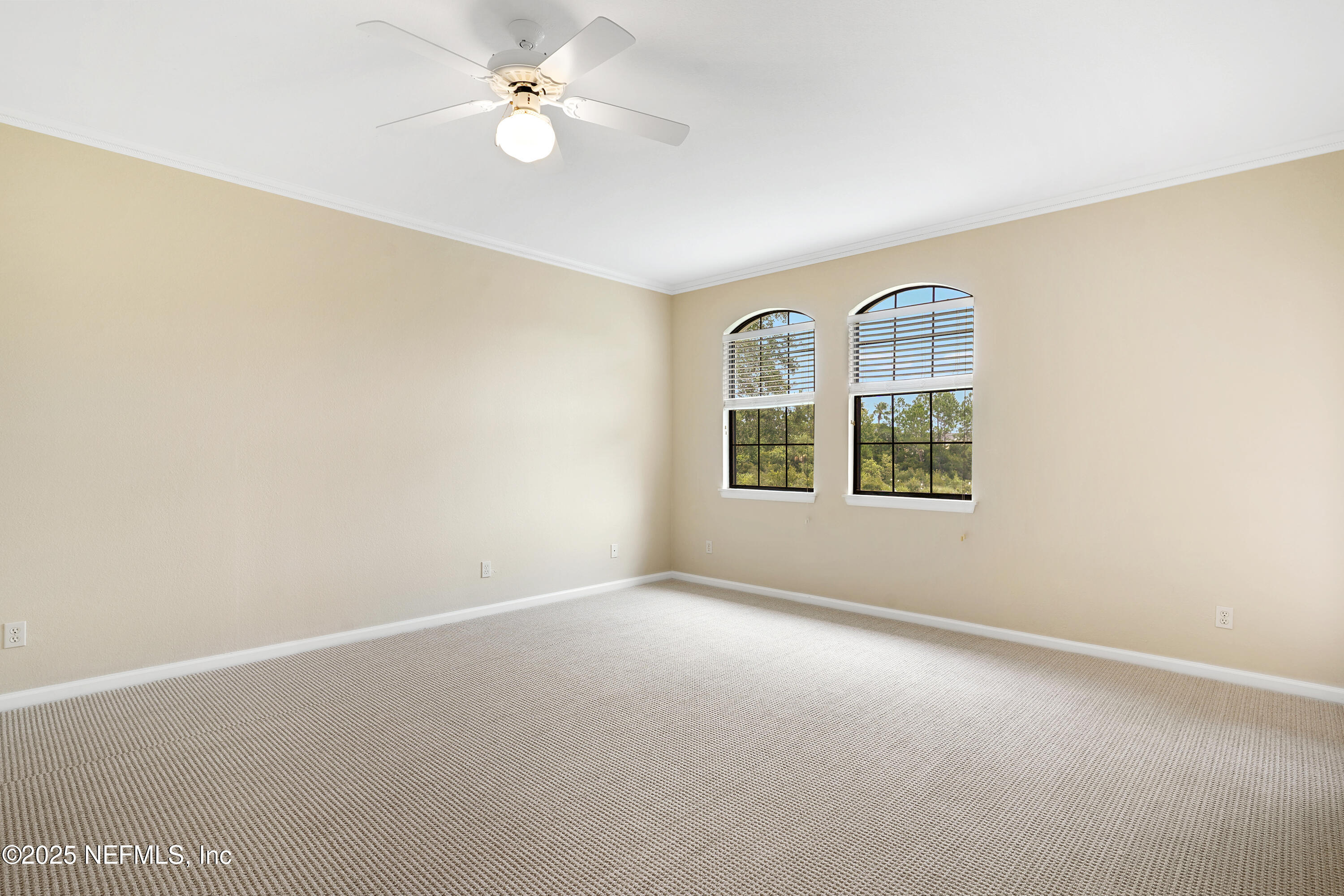 2827 Vista Cove Road St. Augustine, FL 32084 - Photo 16 of 59 an empty room with windows and ceiling fan