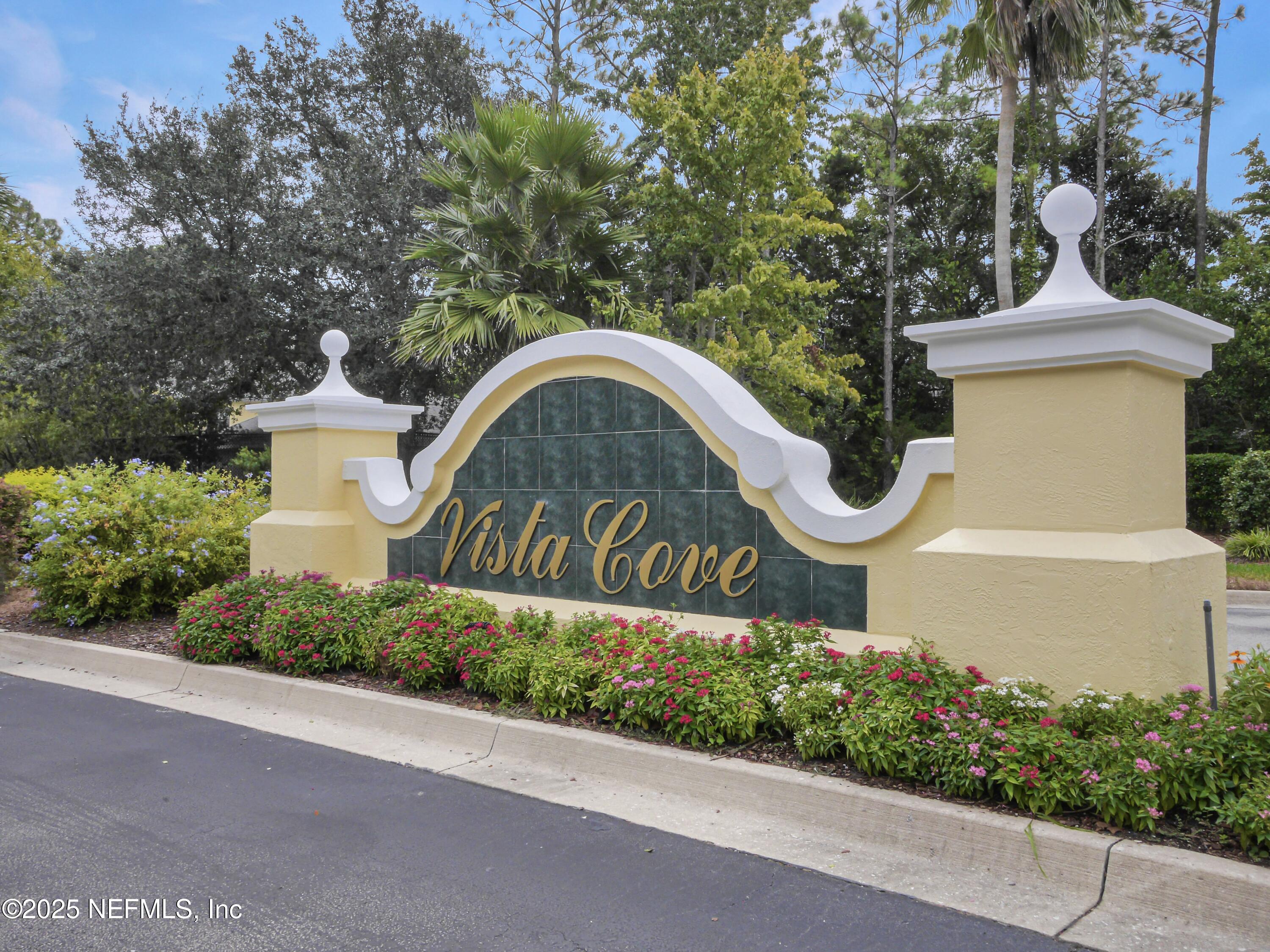 2827 Vista Cove Road St. Augustine, FL 32084 - Photo 2 of 59 a front view of a house with a garden