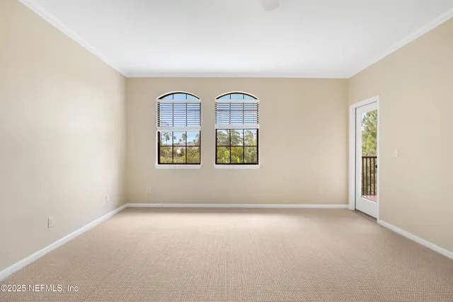 a view of a hallway with wooden floor and potted plants