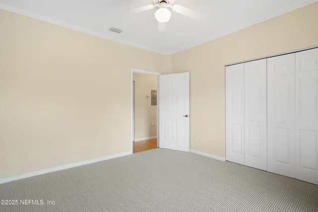 a view of hallway with seating area