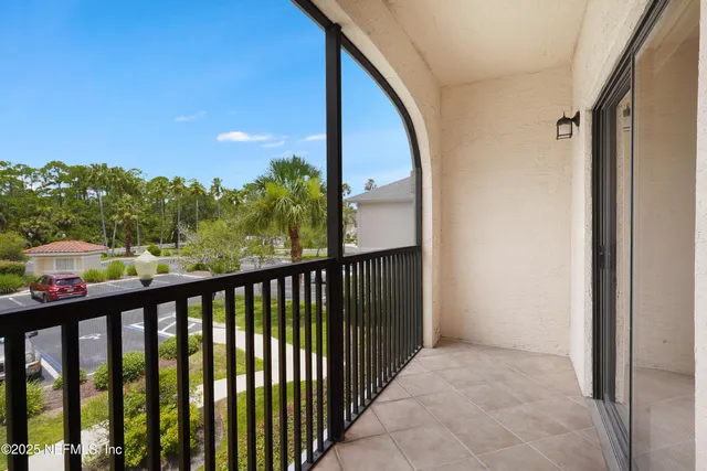 a view of a lake with houses in the back
