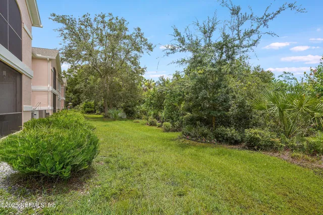 a view of a swimming pool with a yard