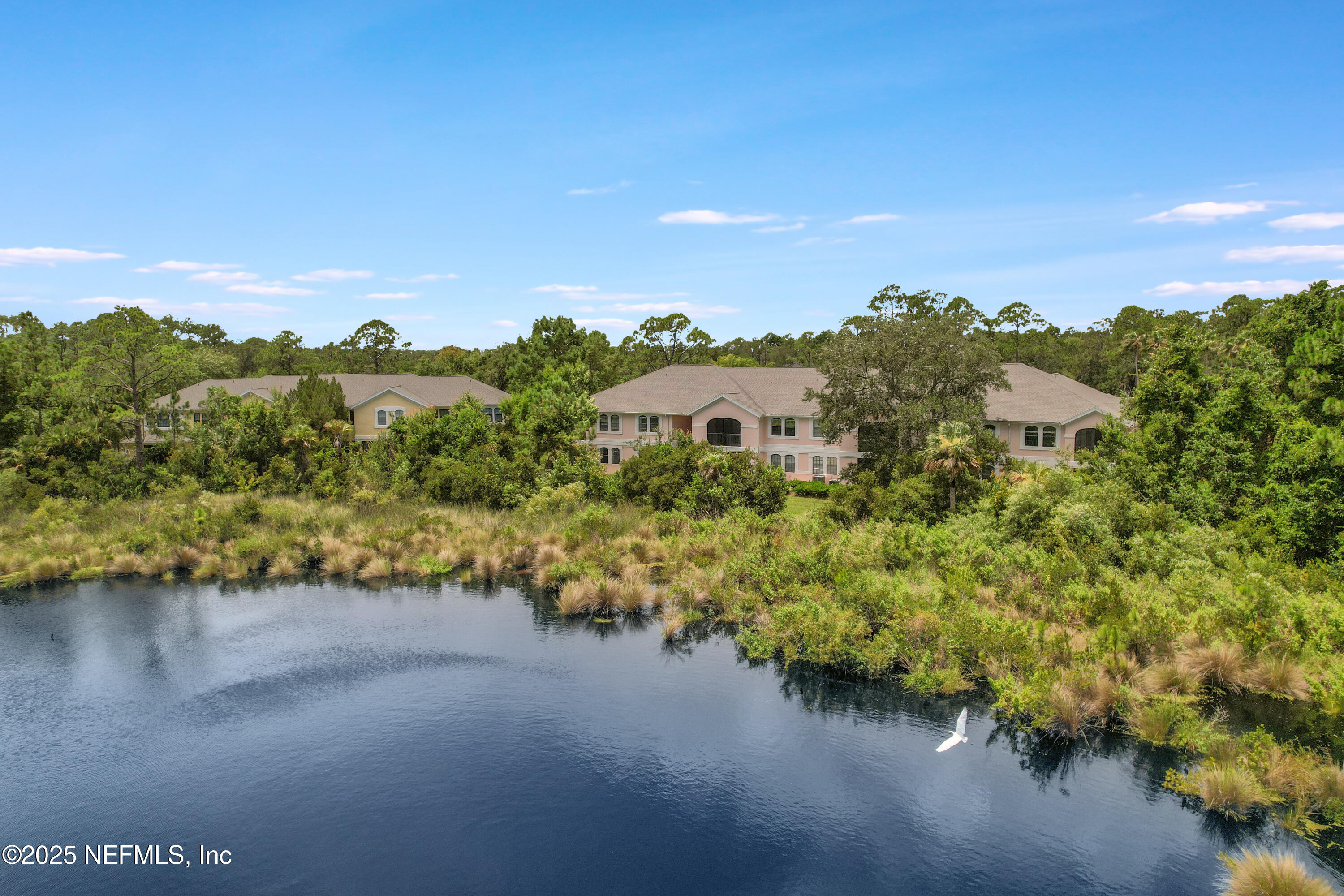 2827 Vista Cove Road St. Augustine, FL 32084 - Photo 38 of 59 a view of a lake with houses in the back