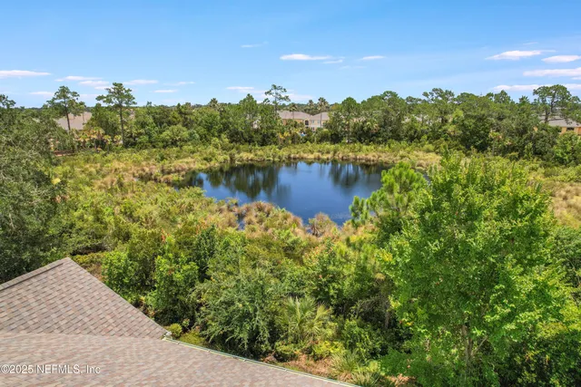 a small pool with trees in the background