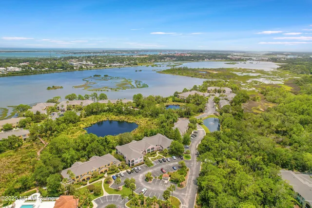 a view of a swimming pool with a yard