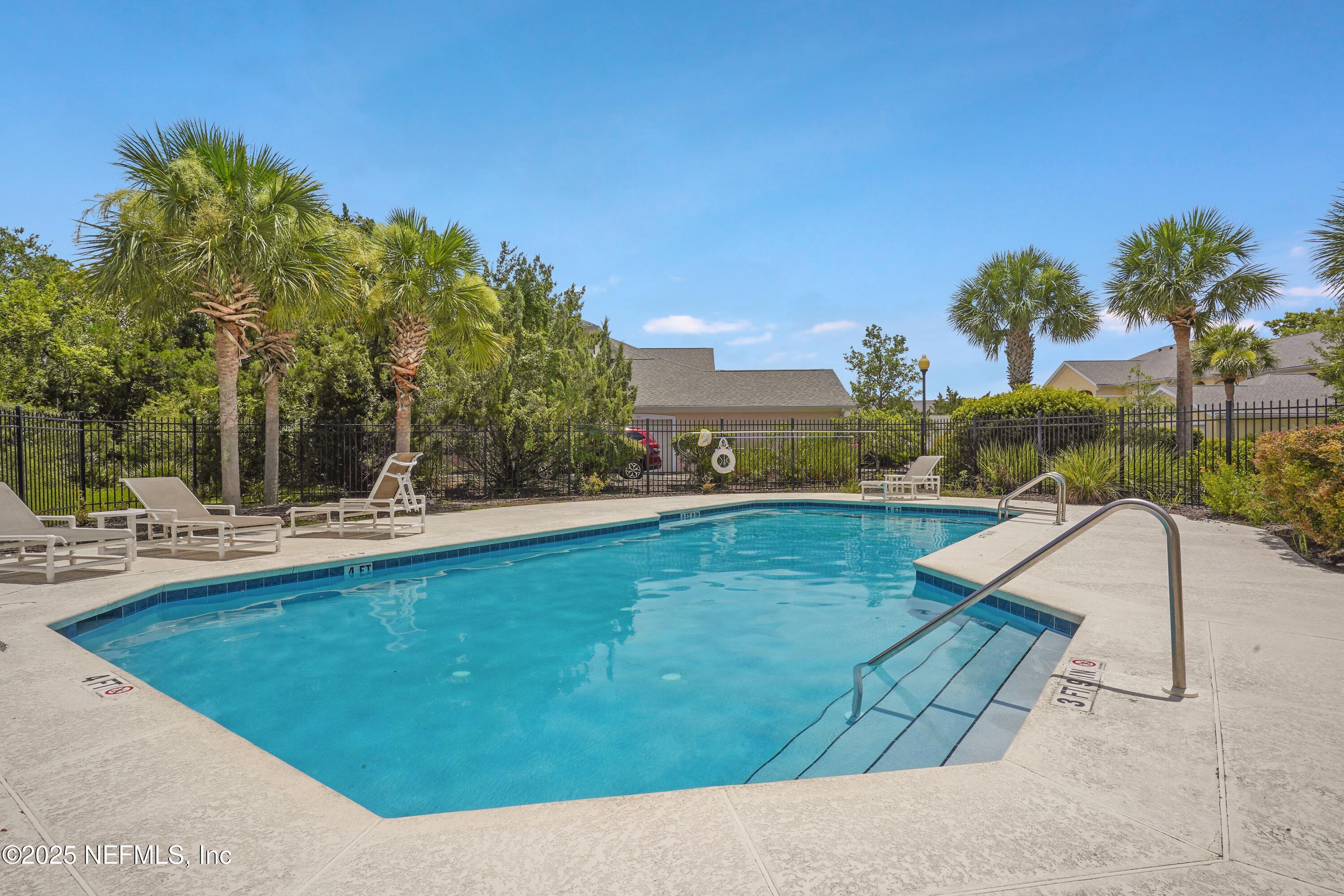 2827 Vista Cove Road St. Augustine, FL 32084 - Photo 48 of 59 a view of a swimming pool with a patio and a yard
