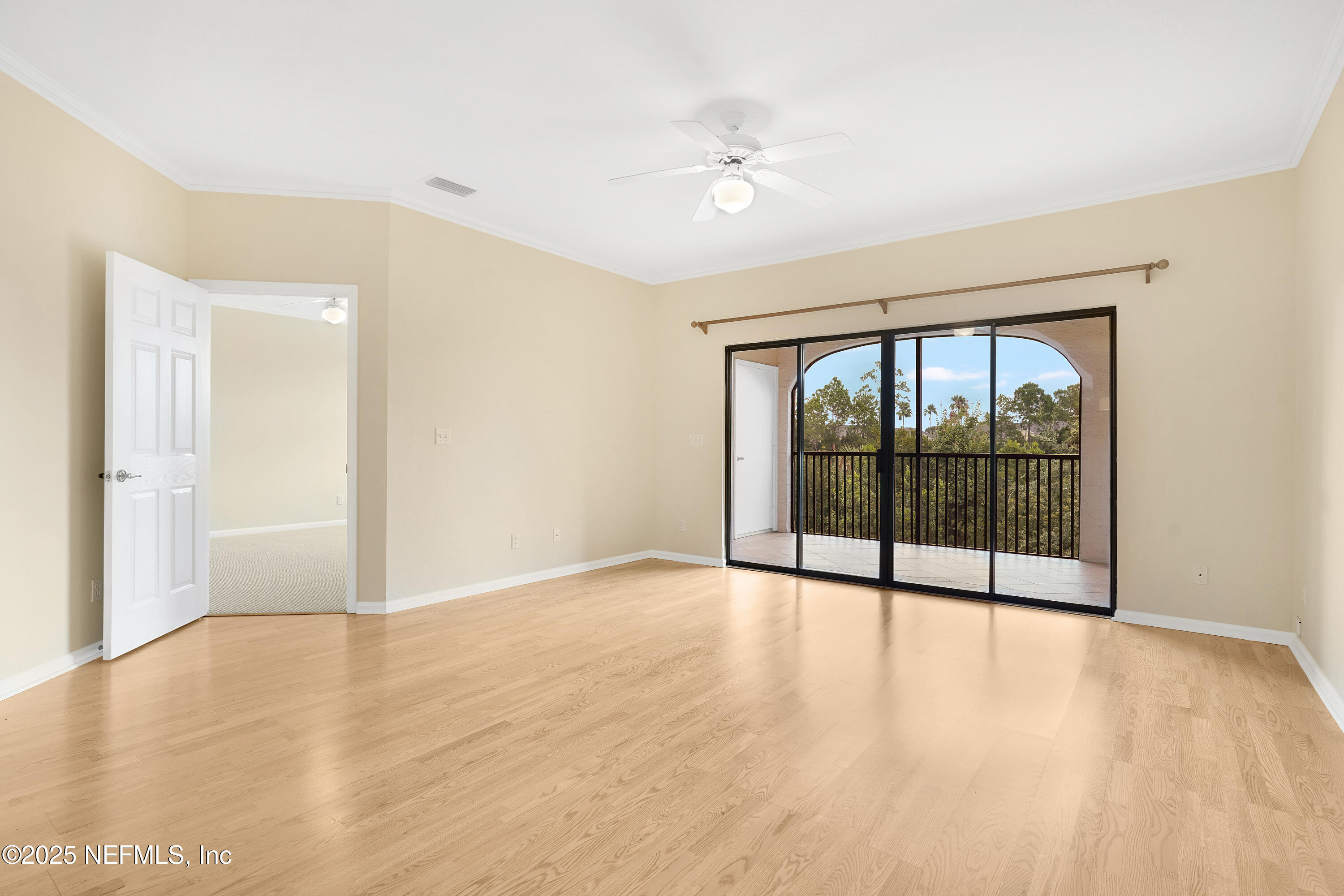 2827 Vista Cove Road St. Augustine, FL 32084 - Photo 8 of 59 wooden floor in an empty room with a window