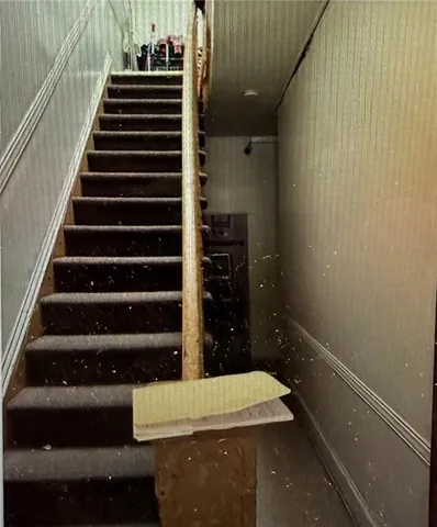 a kitchen with granite countertop a sink stainless steel appliances and cabinets