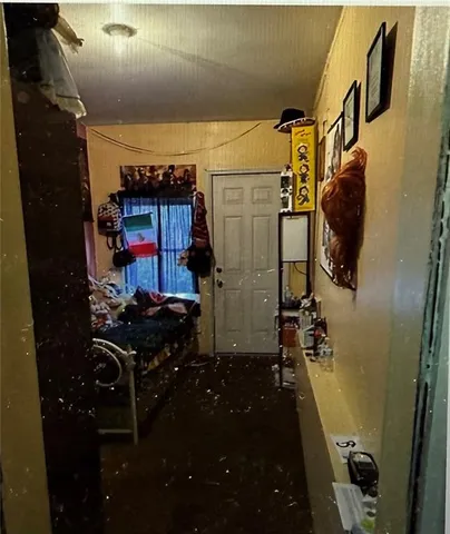 a bed room with furniture and painting on the wall