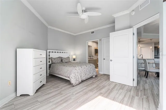 a bedroom with a bed and a dresser