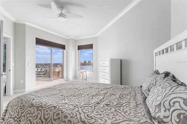 a bedroom with a large bed and a window