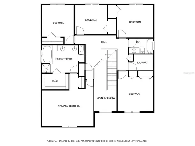 an aerial view of a house with a garden and trees