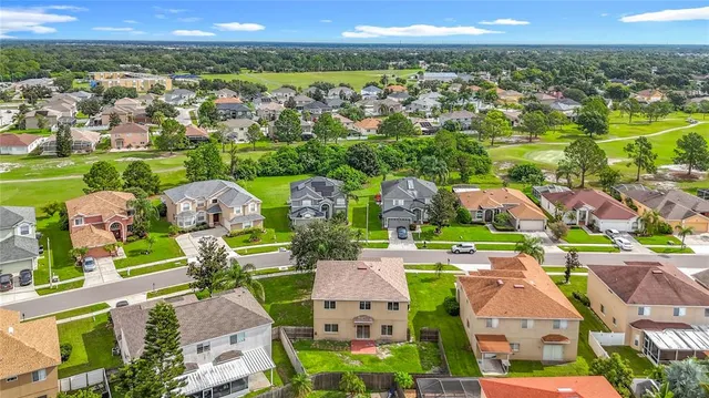 an aerial view of residential building with parking space