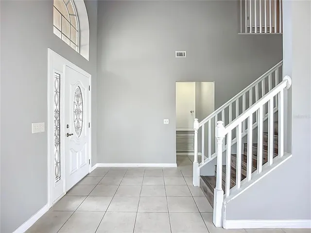 a view of a hallway with staircase