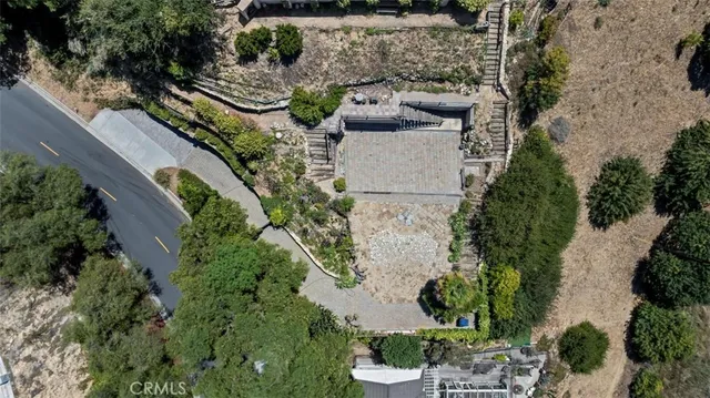 an aerial view of a house with outdoor space