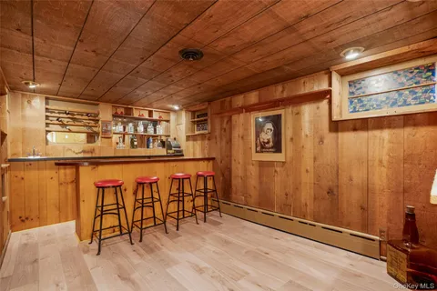 a dining room with furniture and wooden floor