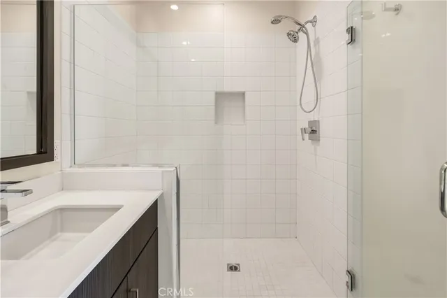a bathroom with a shower and a sink