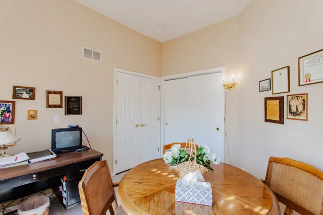 a workspace with furniture and wooden floor