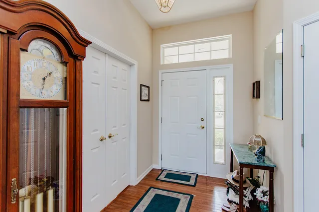 a view of an entryway with wooden floor
