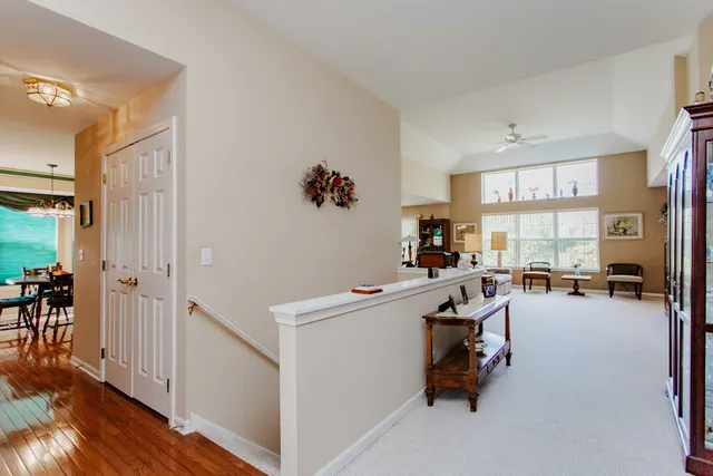 a view of a livingroom with workspace and a window