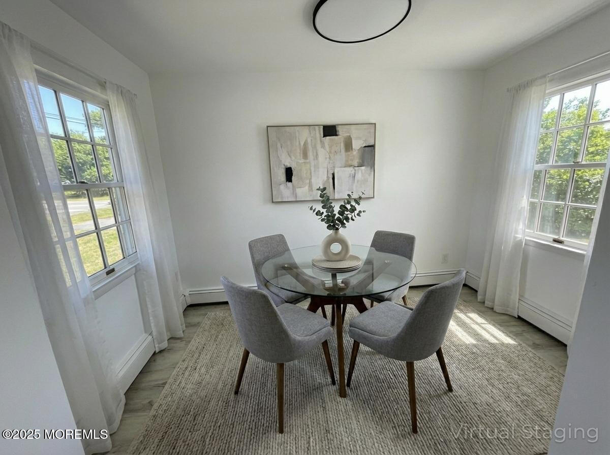 14 3rd Street Keyport, NJ 07735 - Photo 16 of 27 a view of a dining room with furniture and wooden floor