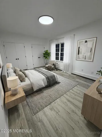 a bedroom with a bed and a couch