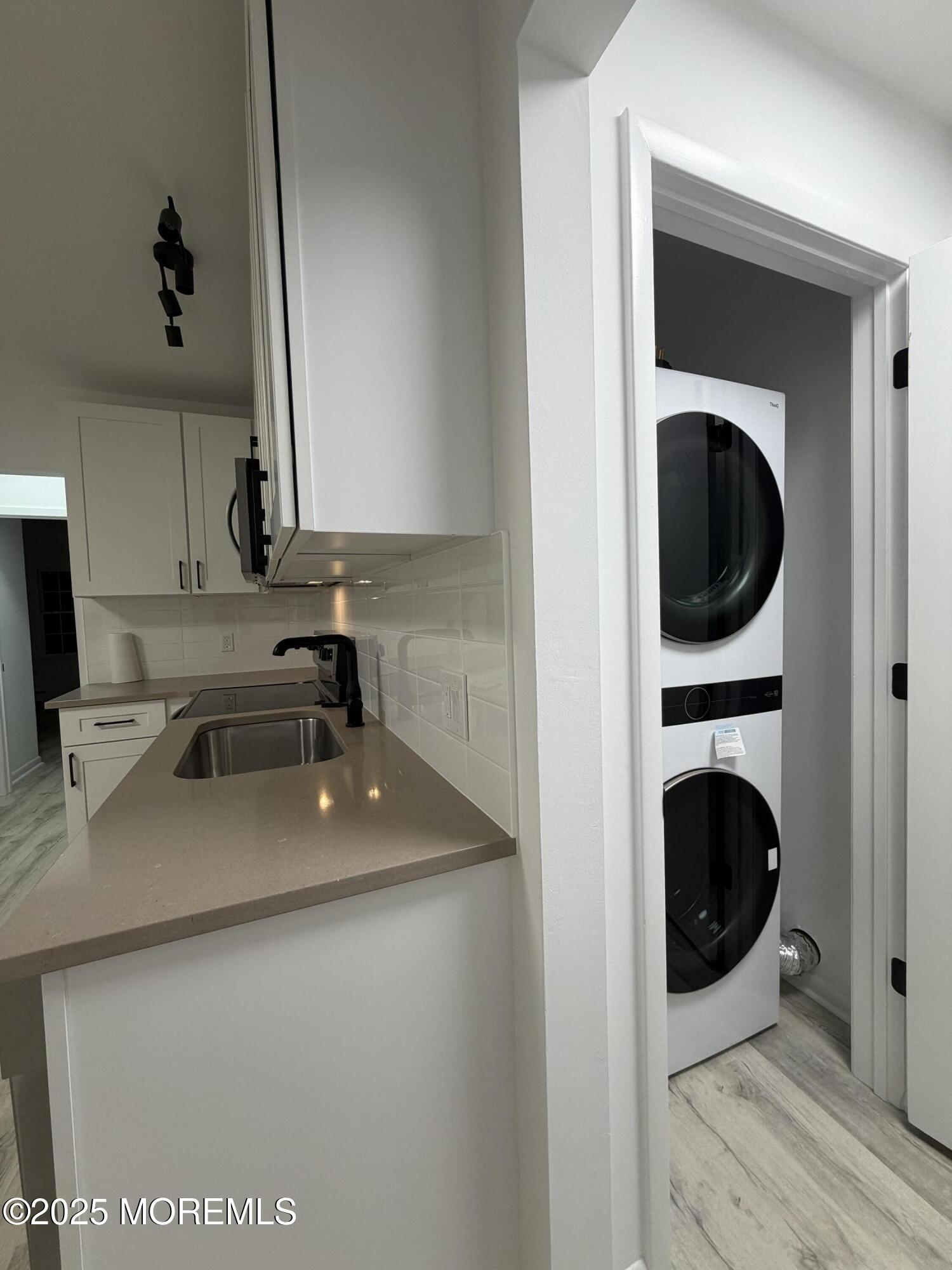 14 3rd Street Keyport, NJ 07735 - Photo 26 of 27 a kitchen with a sink a washer and dryer