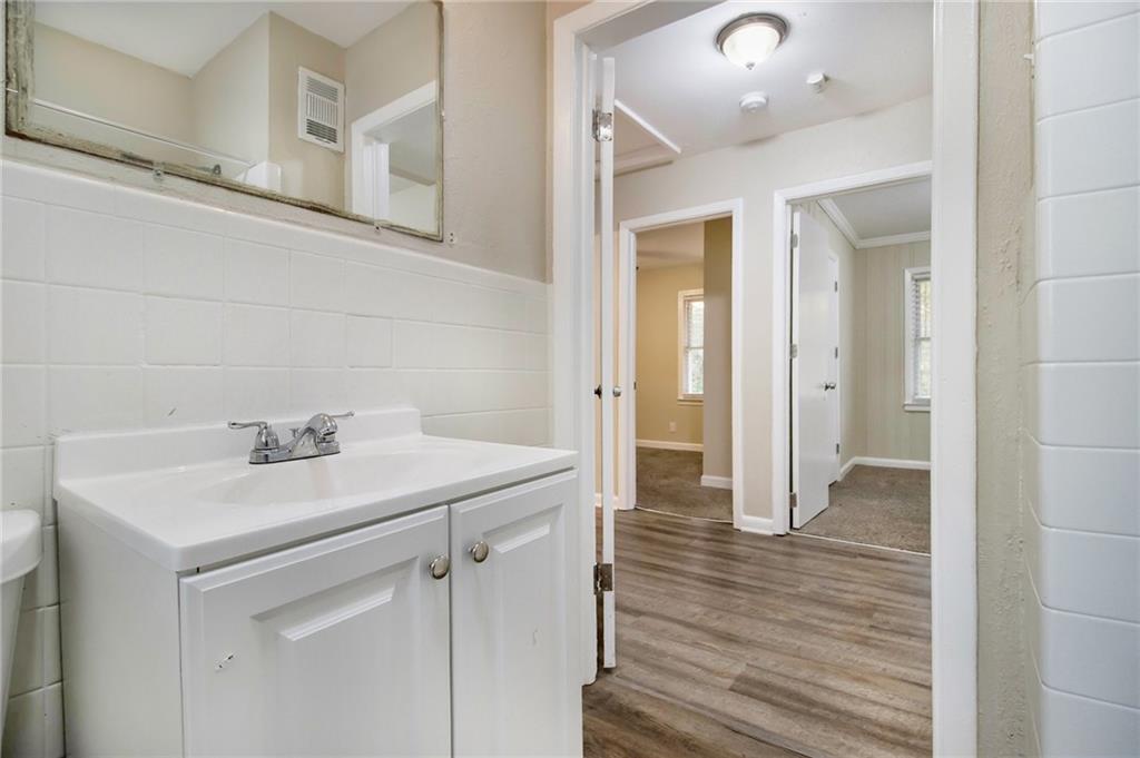 3449 Misty Valley Road Decatur, GA 30032 - Photo 12 of 25 a bathroom with a sink a mirror and a shower