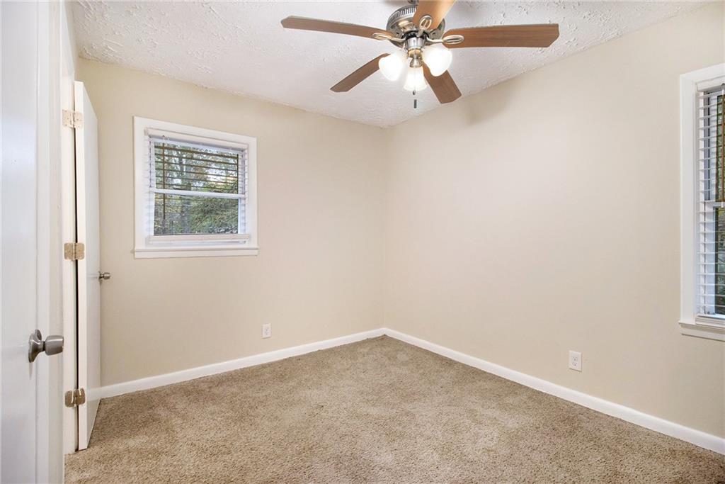 3449 Misty Valley Road Decatur, GA 30032 - Photo 13 of 25 an empty room with a window and a fan