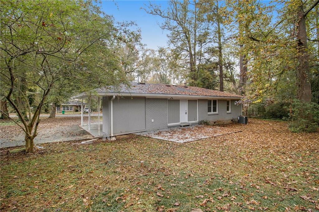 3449 Misty Valley Road Decatur, GA 30032 - Photo 22 of 25 a front view of a house with a garden