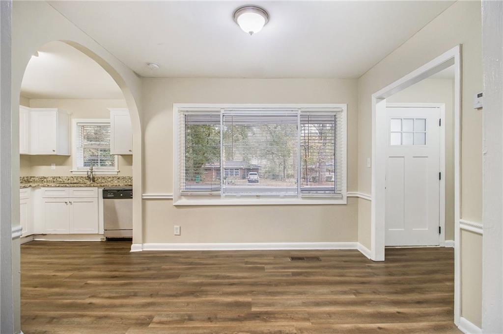 3449 Misty Valley Road Decatur, GA 30032 - Photo 8 of 25 a view of a kitchen with wooden floor and a sink