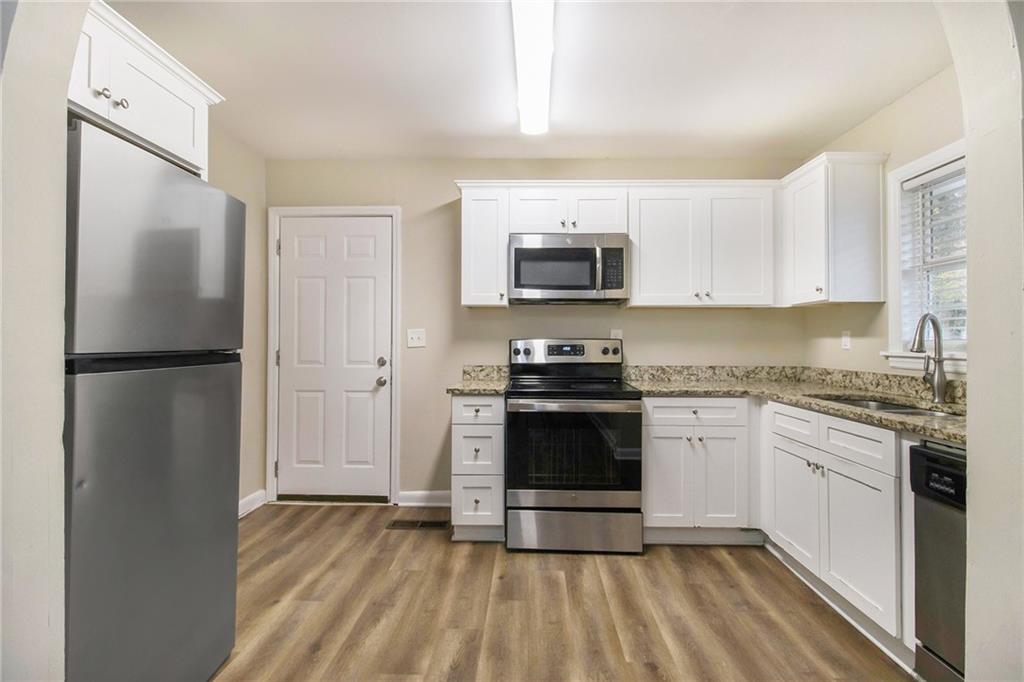 3449 Misty Valley Road Decatur, GA 30032 - Photo 10 of 25 a kitchen with a refrigerator stove and microwave