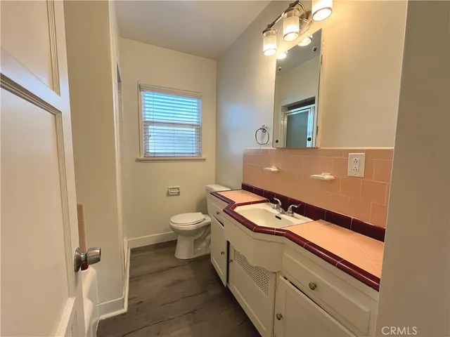 a view of a bathroom with a toilet