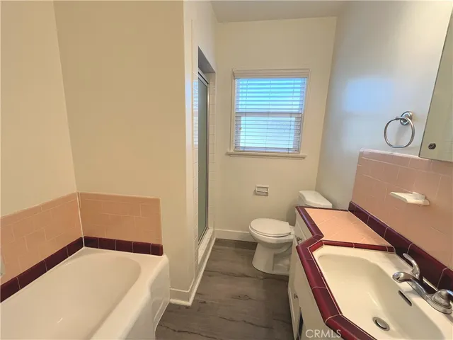a bathroom with a sink toilet and tub