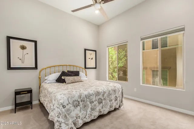 a bedroom with a large bed and a window