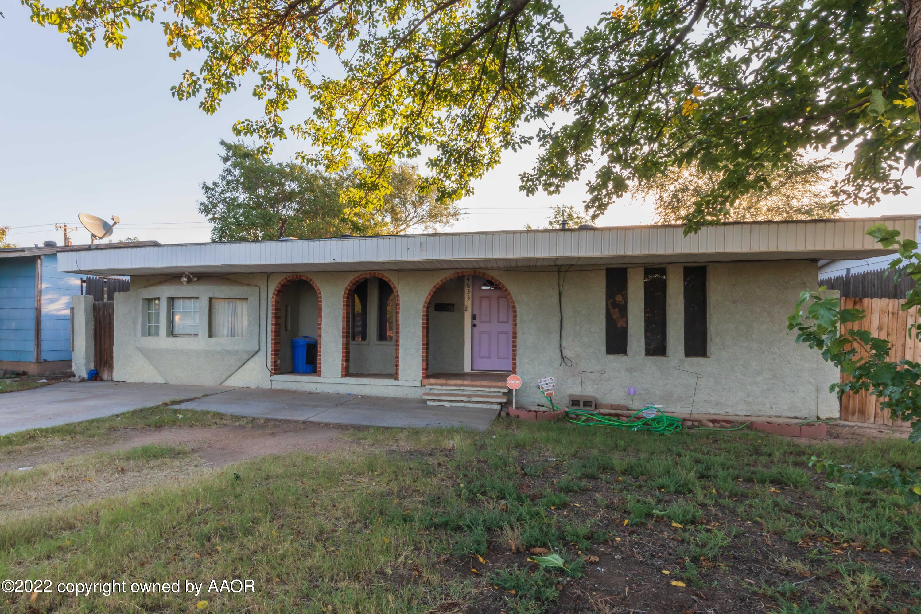 4633 South Hughes Street Amarillo, TX 79110 - Photo 2 of 23 a front view of a house with garden