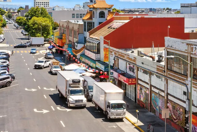 a view of building with cars parked