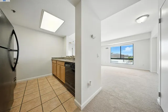 an empty room with a empty space and windows