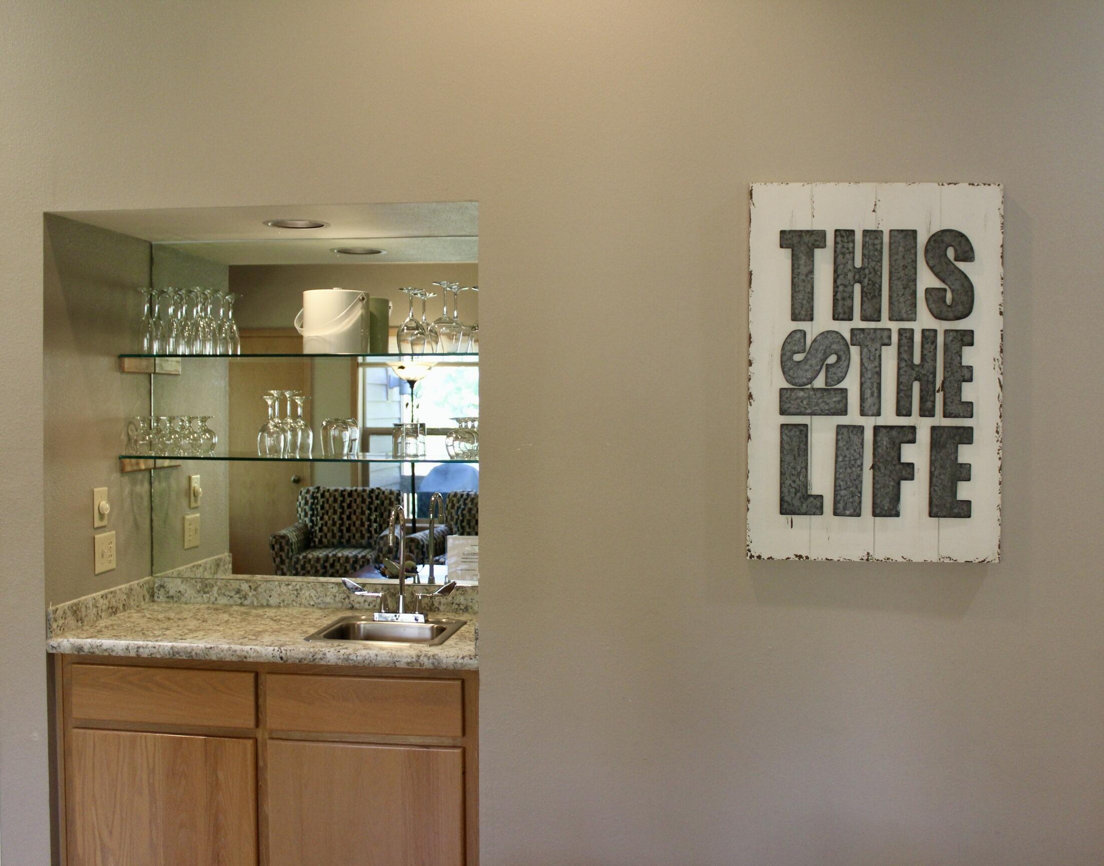 57407 Beaver Ridge Loop, Unit 44C1 Sunriver, OR 97707 - Photo 4 of 19 a kitchen with a sink and cabinets