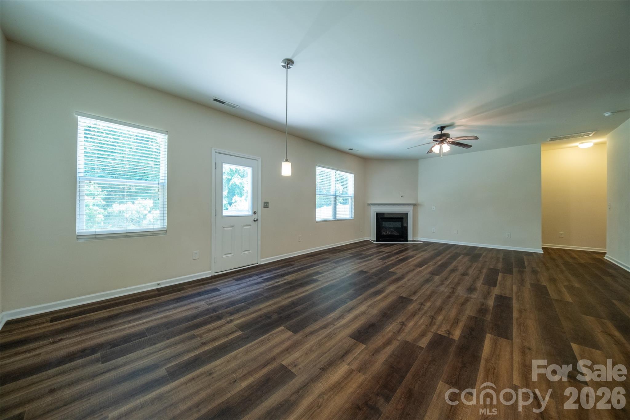 3006 Houndscroft Road Indian Trail, NC 28079 - Photo 15 of 39 a view of empty room with wooden floor and fan